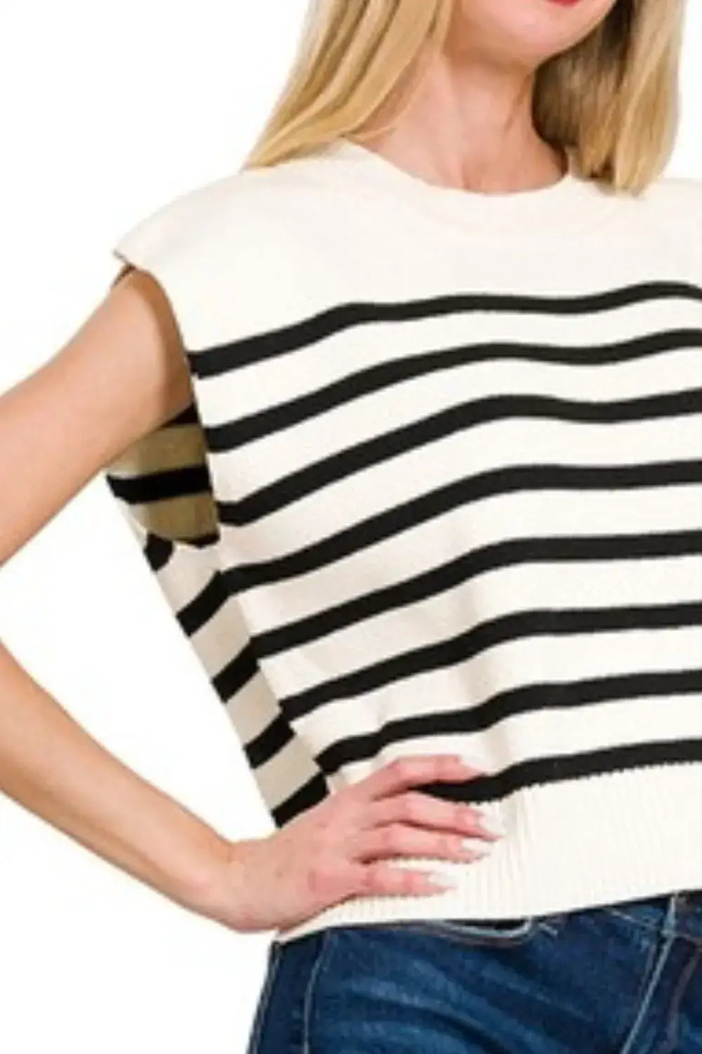 Zenana oversized stripe sweater vest worn over blue jeans, sleeveless cream-colored knit top