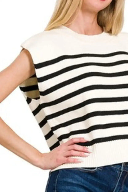 Zenana oversized stripe sweater vest worn over blue jeans, sleeveless cream-colored knit top