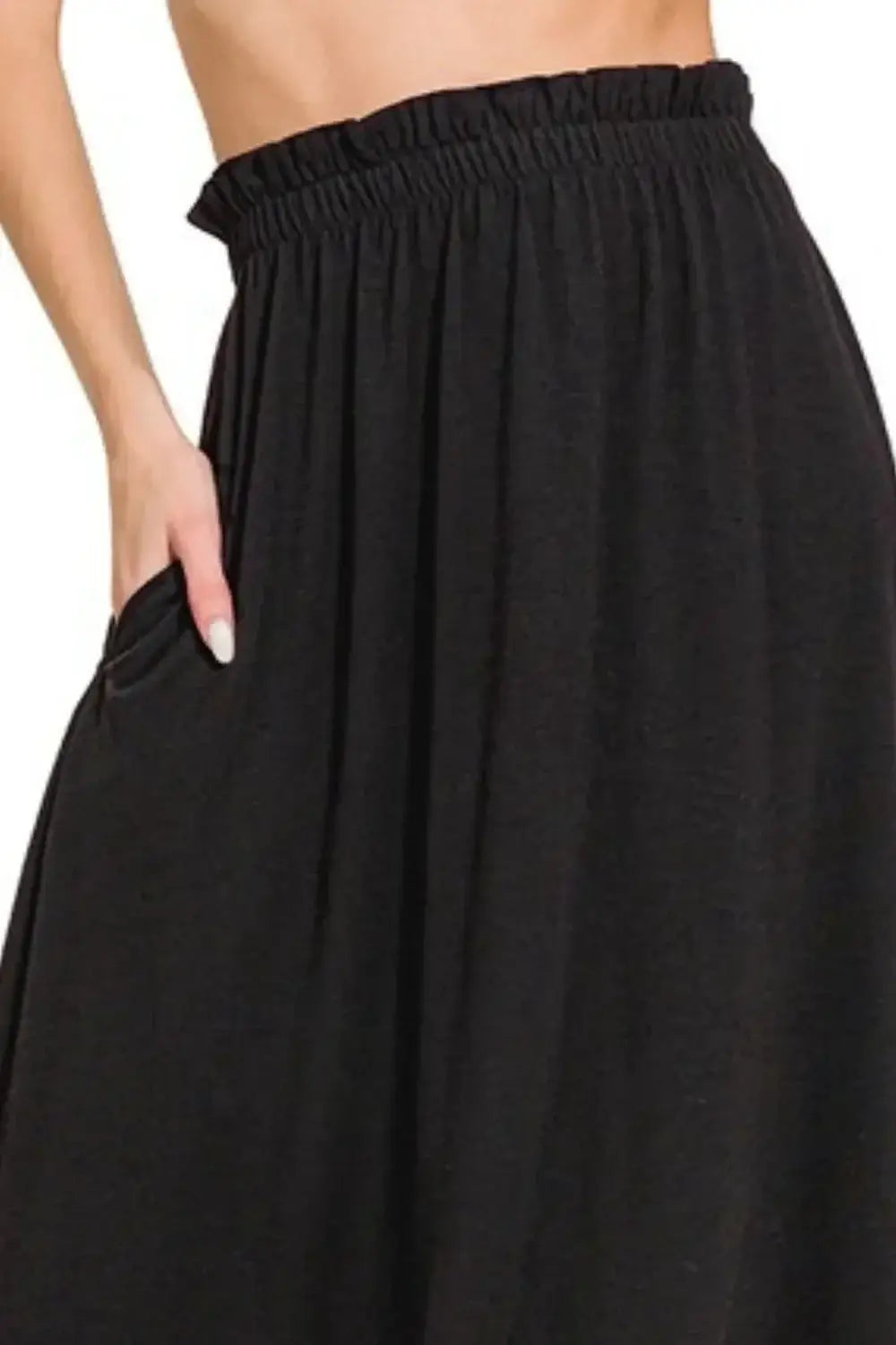 Black cotton paperbag waist midi skirt with elastic waistband and pockets for casual style