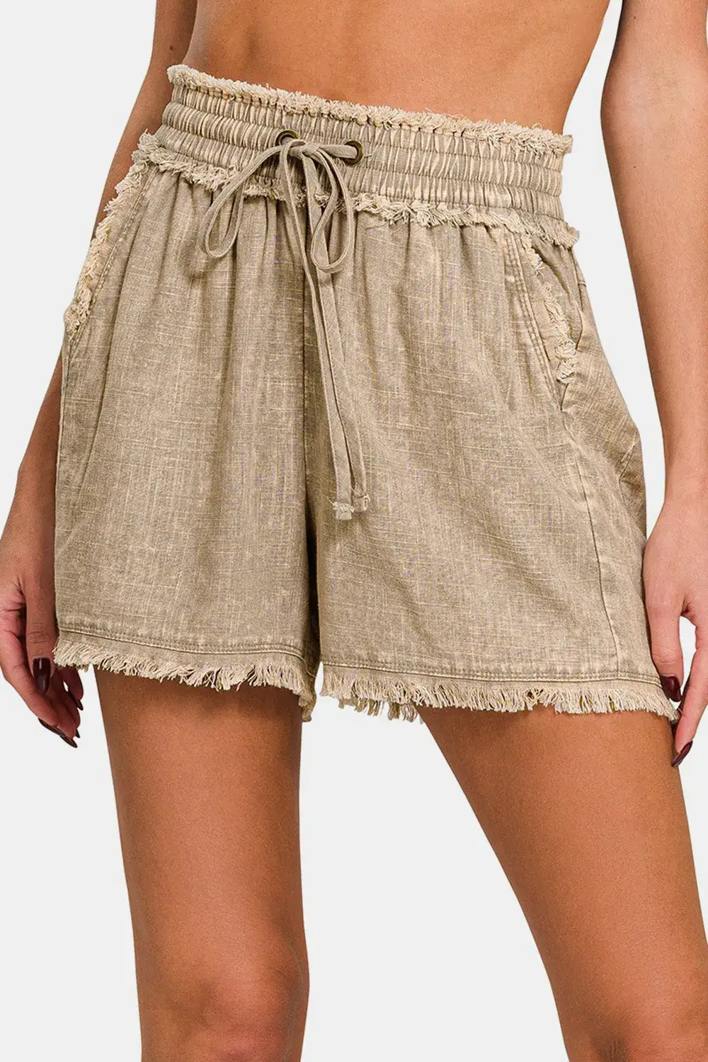 Beige washed linen frayed hem shorts with smocked waistband and drawstring detail