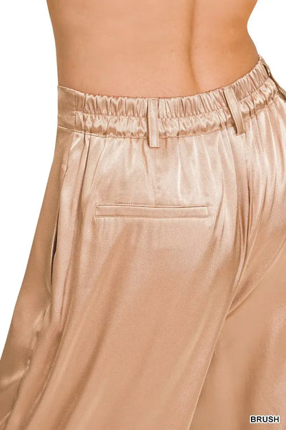 Gold satin wide-leg satin pants with elastic waistband and pocket detail