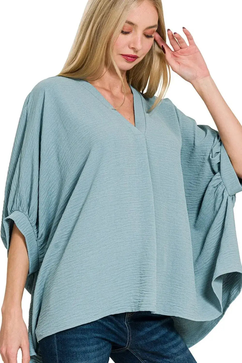 Light blue Zenana woven airflow puff half sleeve blouse with textured fabric and v-neck