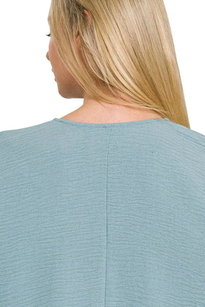 Light blue textured Zenana woven airflow puff half sleeve top with round neckline